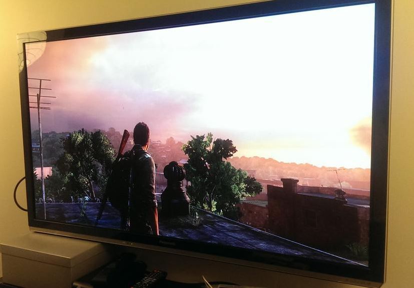 Screenshot of Joel and a sunset in The Last of Us